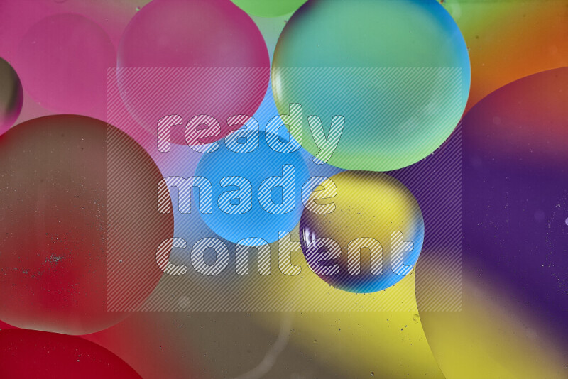 Close-ups of abstract oil bubbles on water surface in multicolors