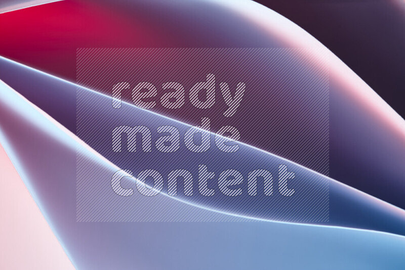 This image showcases an abstract paper art composition with paper curves in blue and red gradients created by colored light
