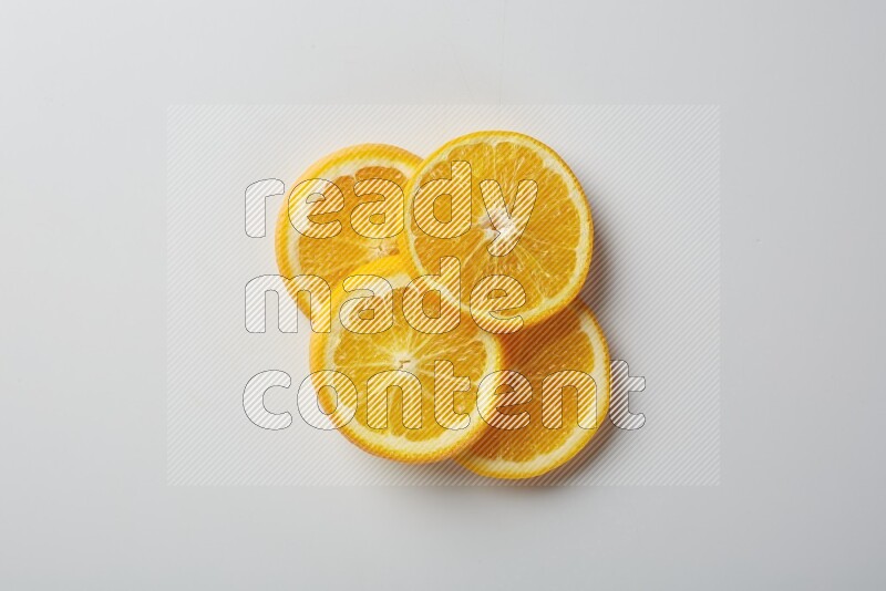 Four orange slices on a white background