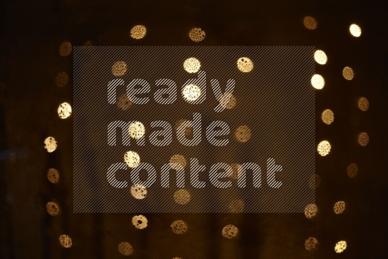 Bokeh light in yellow with water drops