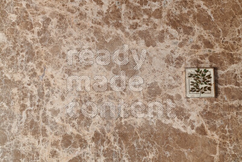 A decorative coaster on beige marble background