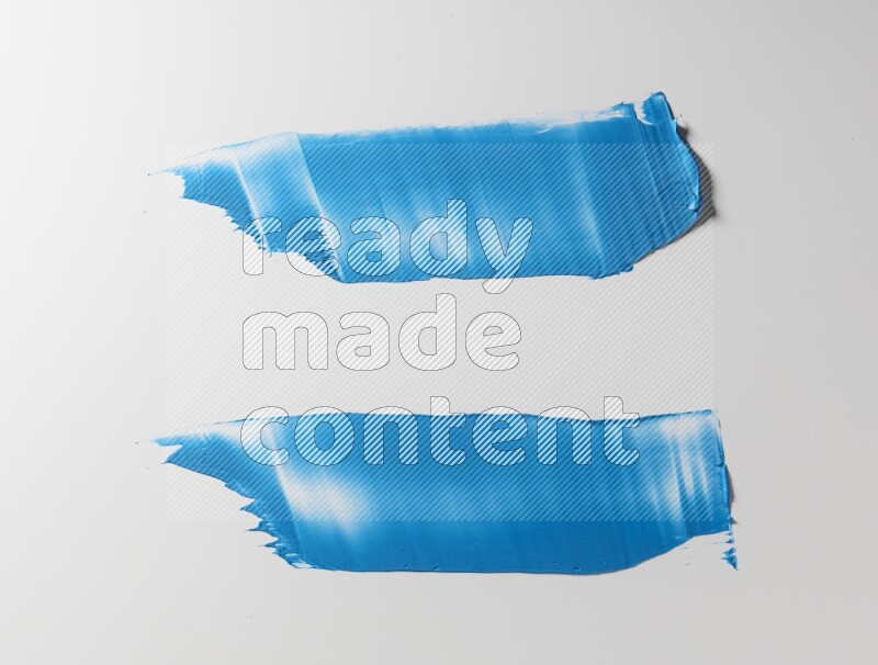 Blue painting knife strokes on white background