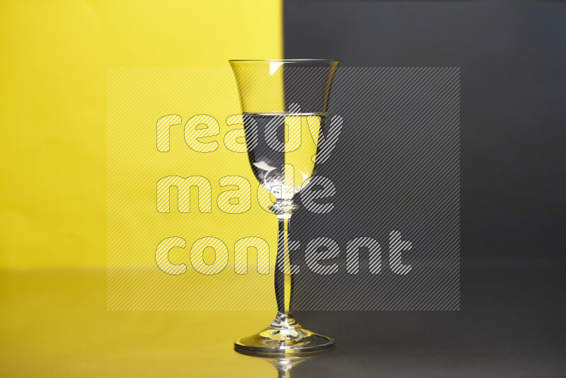 The image features a clear glassware filled with water, set against yellow and black background