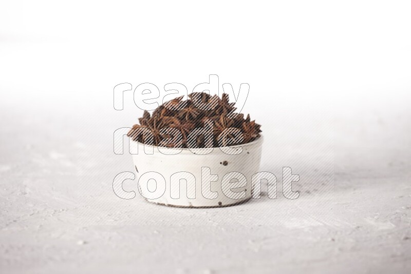 Star Anise in a white bowl on white background