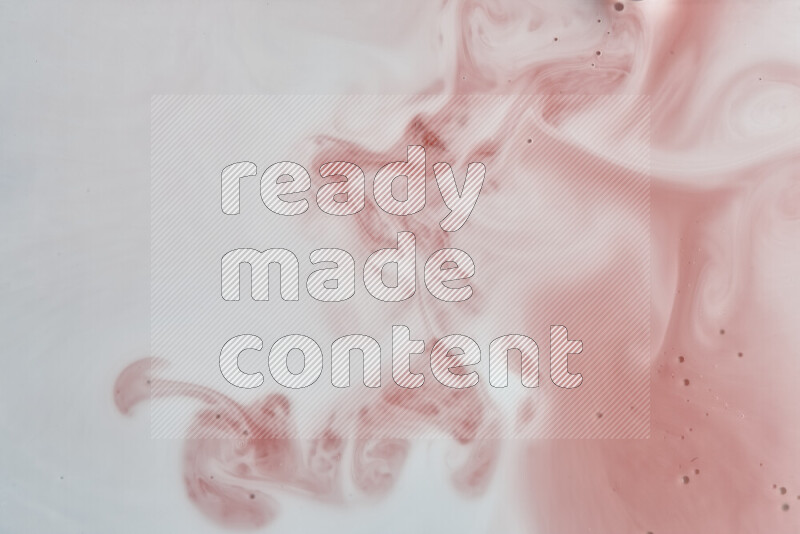 A close-up of abstract swirling patterns in red and white