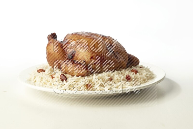 white  basmati Rice with  whole roasted chicken  on a white rounded plate direct on white background