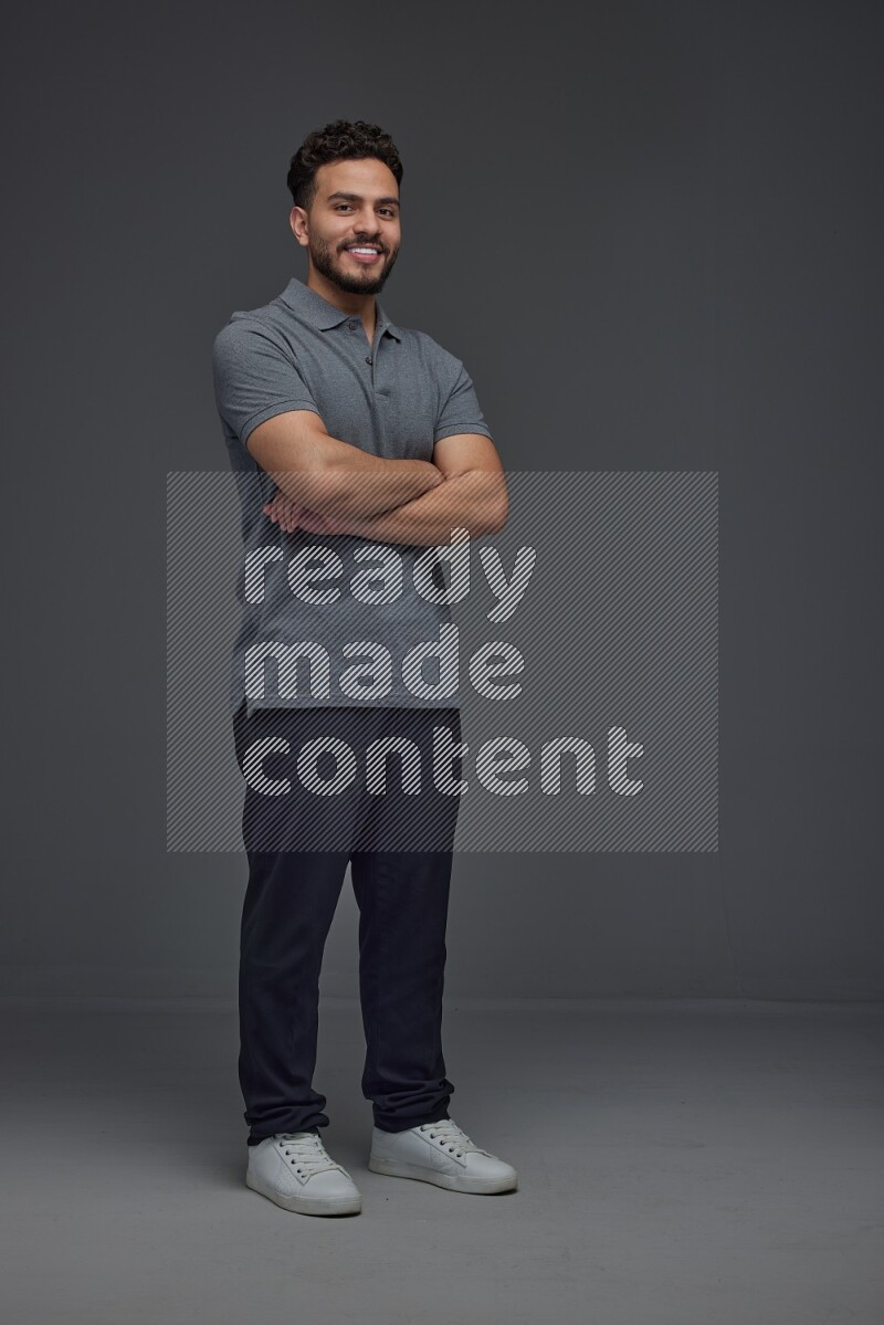 A man wearing casual making multi stand poses  eye level on a gray background