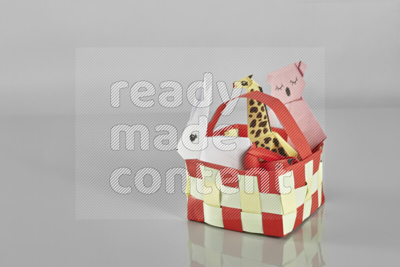 Origami animals on grey background