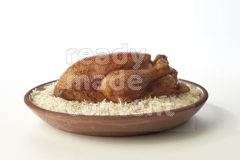 white  basmati Rice with  whole roasted chicken    on a pottery plate  direct  on white background
