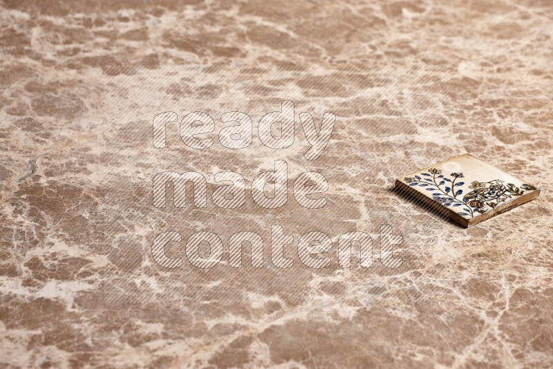 A decorative coaster on beige marble background
