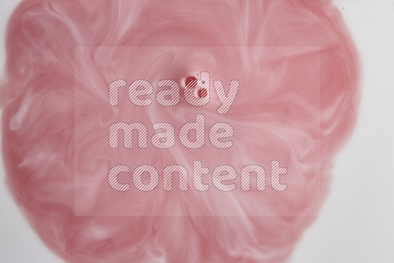 A close-up of abstract swirling patterns in red and white