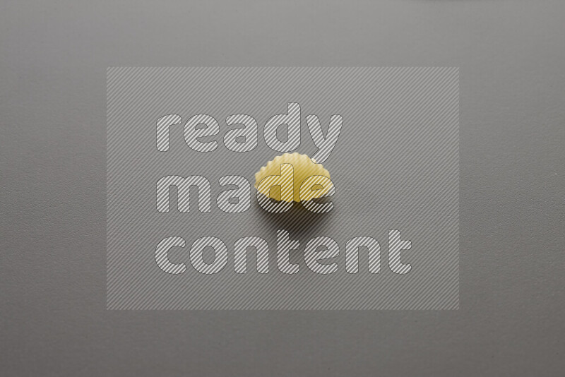 Shells pasta on grey background