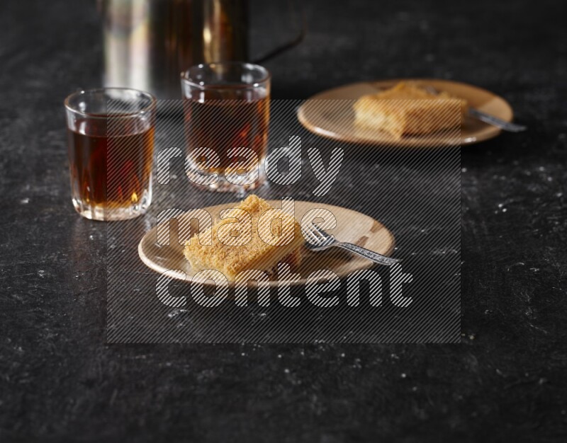 konafa with tea in a dark setup