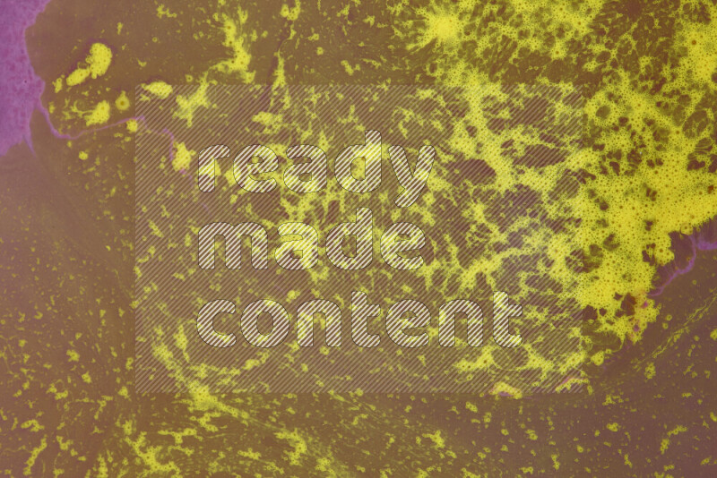 The image depicts a marbling effect with swirling patterns of purple and yellow