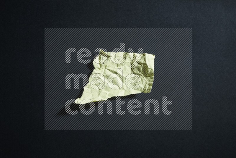 Yellow paper sheet on black background