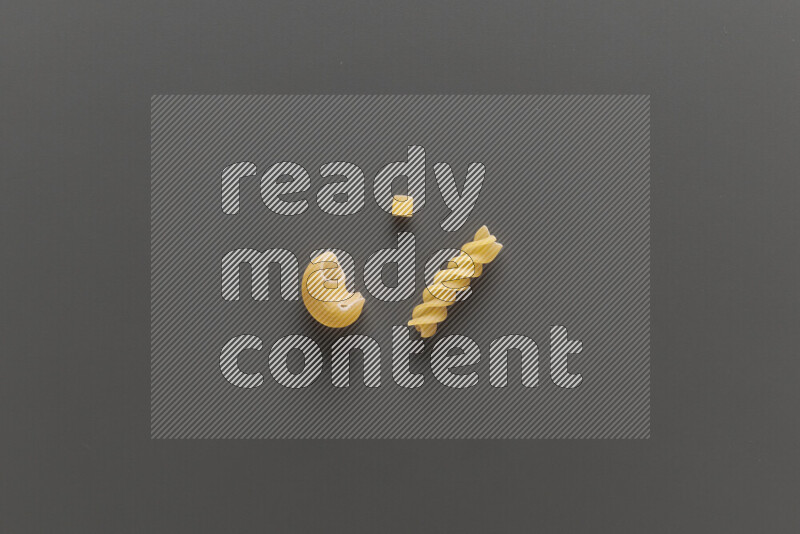 Different pasta types on grey background