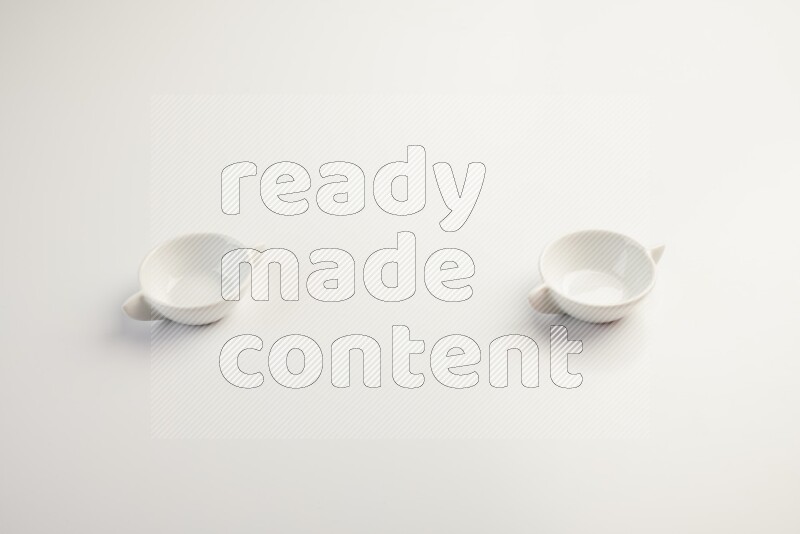 white ceramic round sauce dish on white countertop