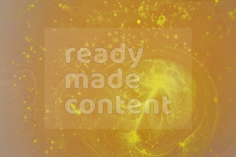 The image captures a dramatic splatter of yellow paint over a white backdrop