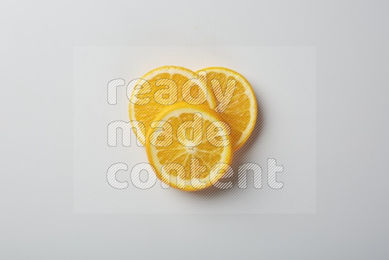 Three orange slices on a white background