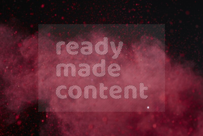 Red powder explosion on black background