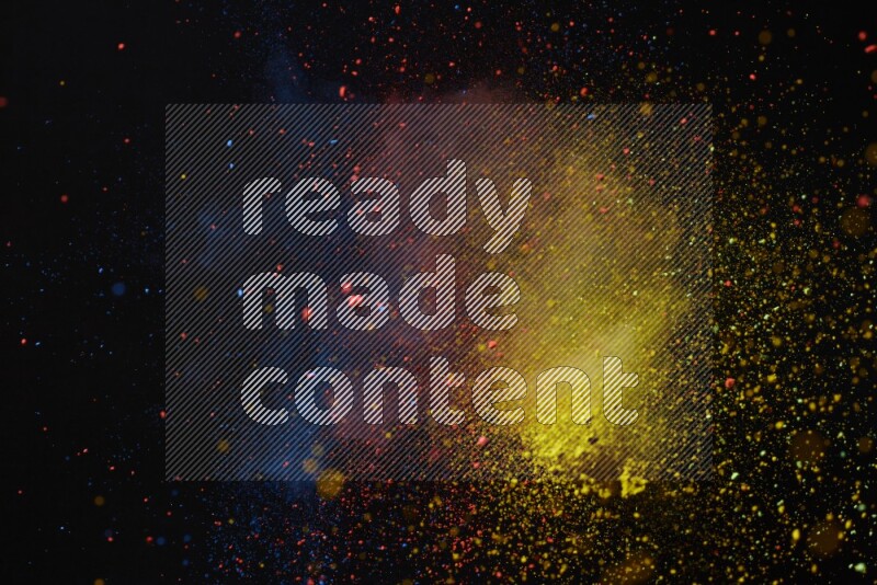 Colorful powder explosion on black background