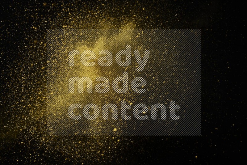Yellow powder explosion on black background