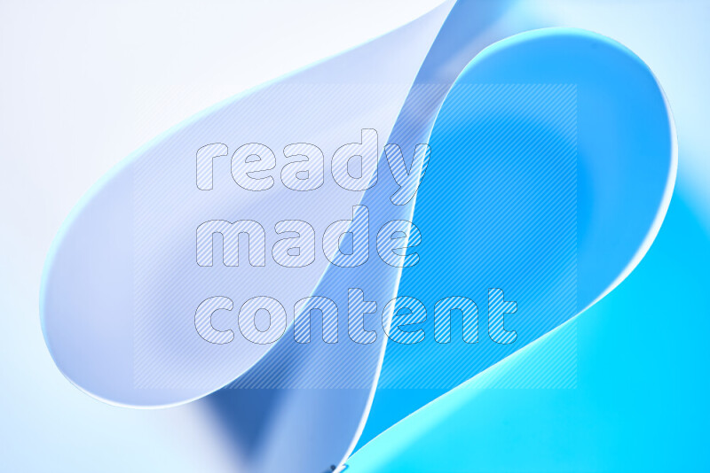 An abstract art of paper folded into smooth curves in white and blue gradients