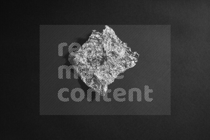 Aluminium foil on black background