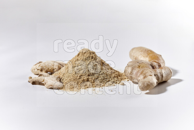 A bunch of ground ginger powder on white background