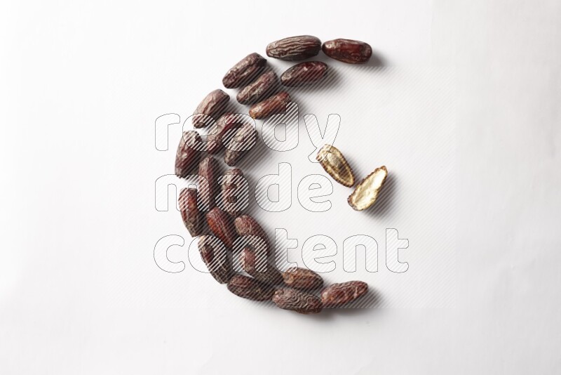 Dates in a crescent shape on white background