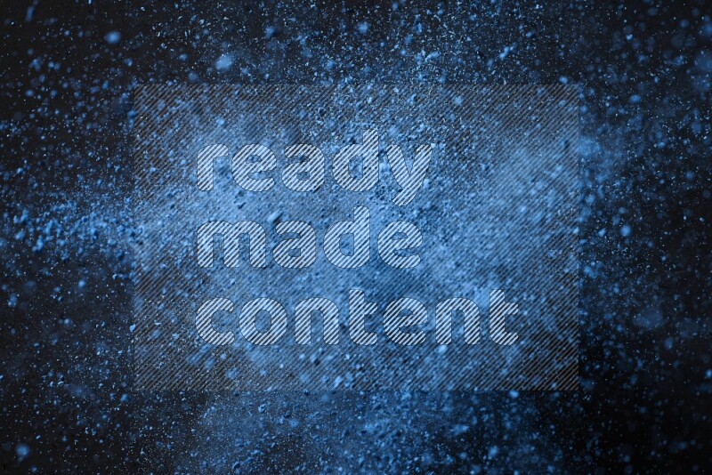 Blue powder explosion on black background