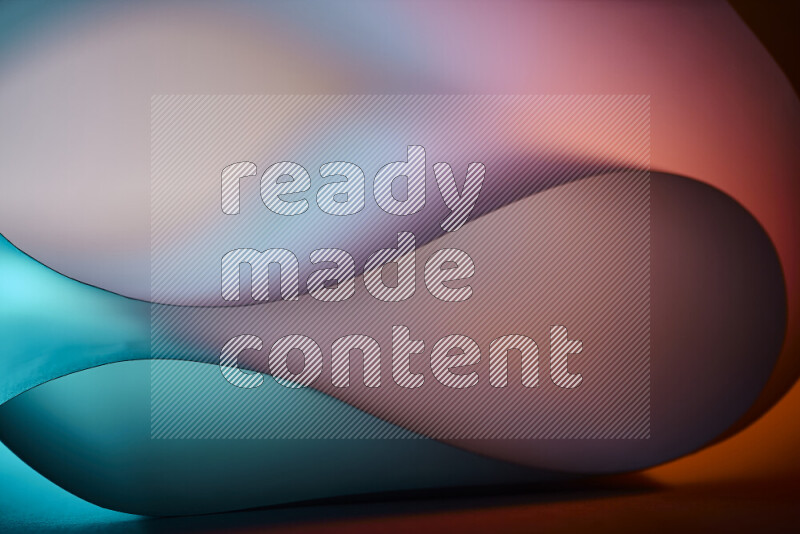 An abstract art piece displaying smooth curves in blue and orange gradients created by colored light