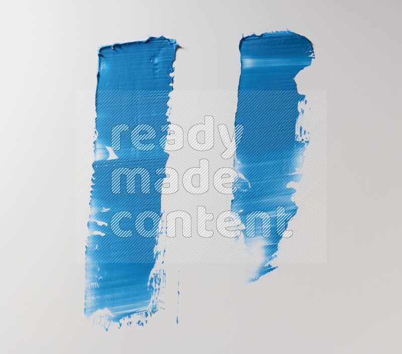 Blue painting knife strokes on white background