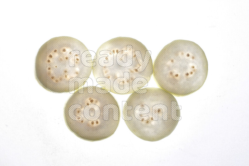 Guava slices on illuminated white background