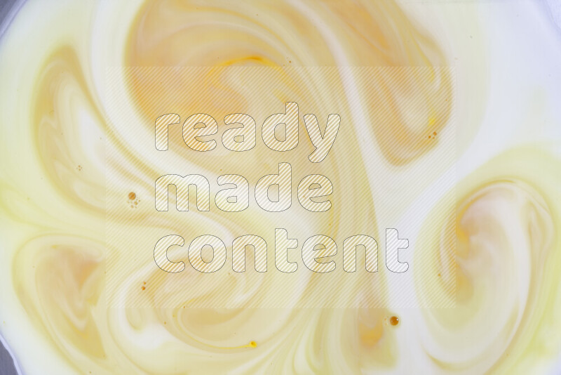 A close-up of abstract different swirling patterns in orange