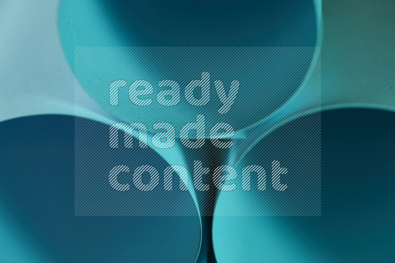 The image shows an abstract paper art with circular shapes in varying shades of blue