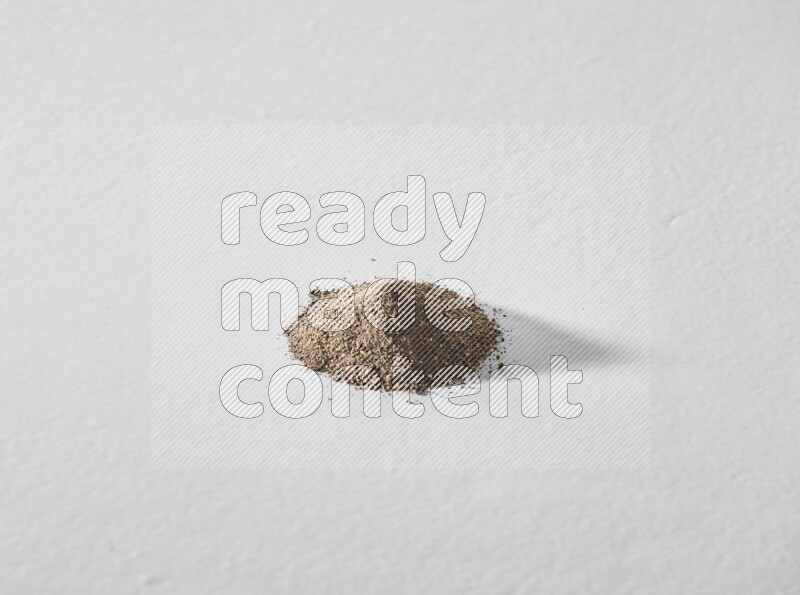 Black pepper powder on a white background