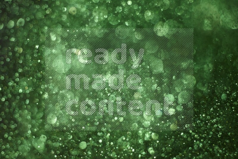 Green glitter powder isolated on black background