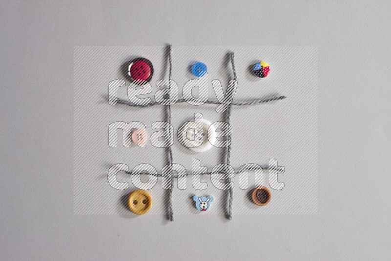 Multicolored buttons placed on grey background