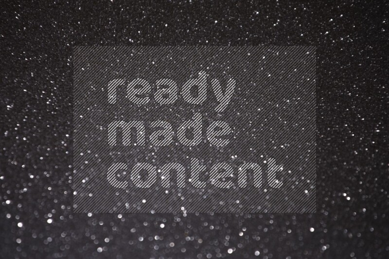 Black glittery bokeh background