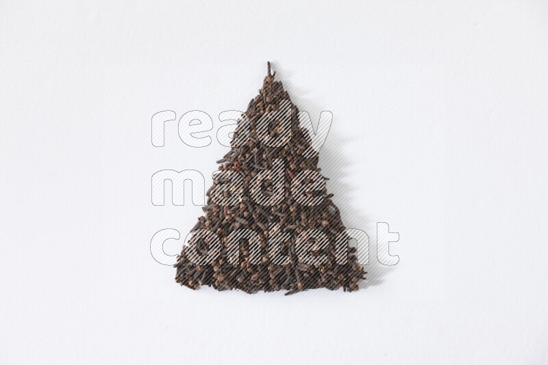 cloves in a triangle shape on a white flooring
