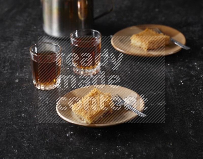 konafa with tea in a dark setup