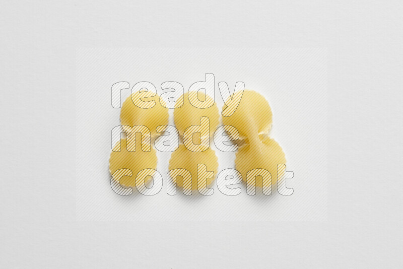 Fiocchi pasta on white background