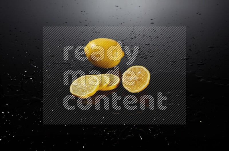 Lemon slices with water drops, and droplets on black background