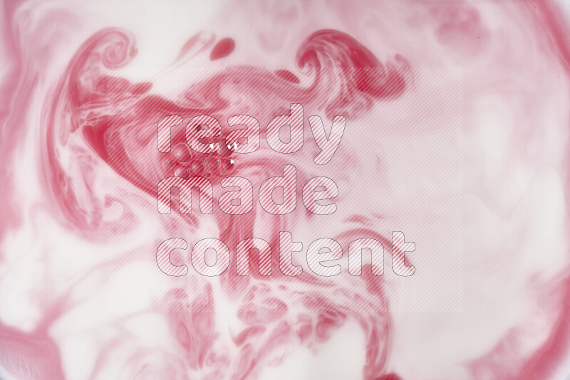 A close-up of abstract swirling patterns in red and white