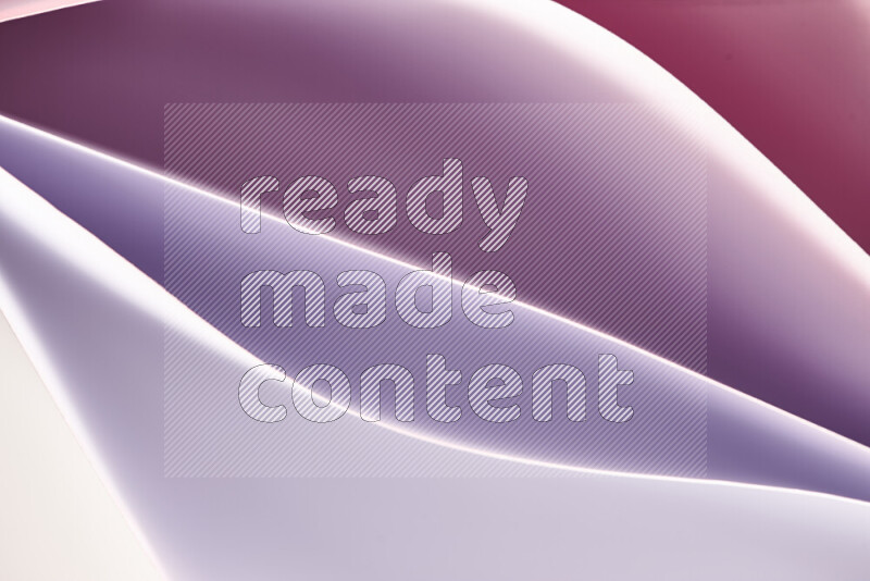 This image showcases an abstract paper art composition with paper curves in white and different warm gradients created by colored light