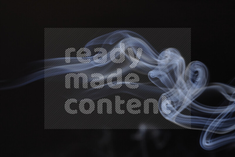 Motion of wavy smoke isolated on dark background