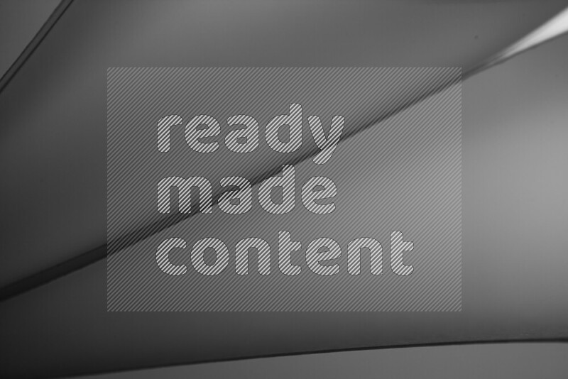 An abstract art showing grey paper sheets arranged in an overlapping curves