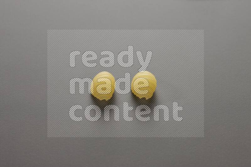 Shells pasta on grey background