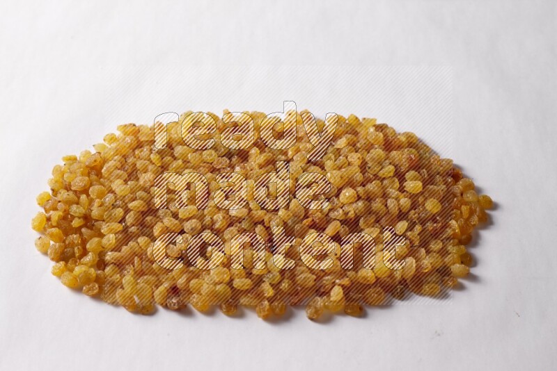 Raisins on white background